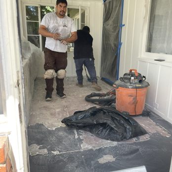 Lam's Flooring - Grinding/ scraping peeling paint - Flooring Near Me