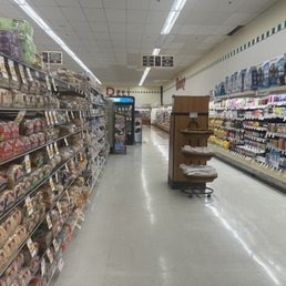 grocery store aisle filled with goods grocery store aisle filled with goods