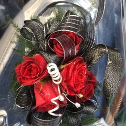 The Flower Pot - Red rose corsage with black ribbon.