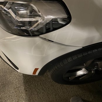 National Auto Collision - Before: Dent in bumper (clips pushed out) - Body Shops Near Me - Kent, Washington