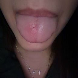 CROOKED TONGUE PIERCING.
