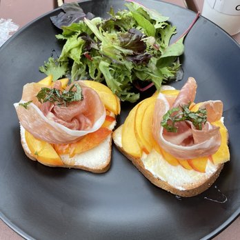 Cuppi Coffee - Peach, ricotta and prosciutto toast with gluten free bread and a side salad - Coffee & Tea Near Me - Bristow, Virginia Cuppi Coffee - Peach, ricotta and prosciutto toast with gluten free bread and a side salad - Coffee & Tea Near Me - Bristow, Virginia