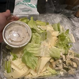 Welted lettuce and cold refrigerated chix caeser salad