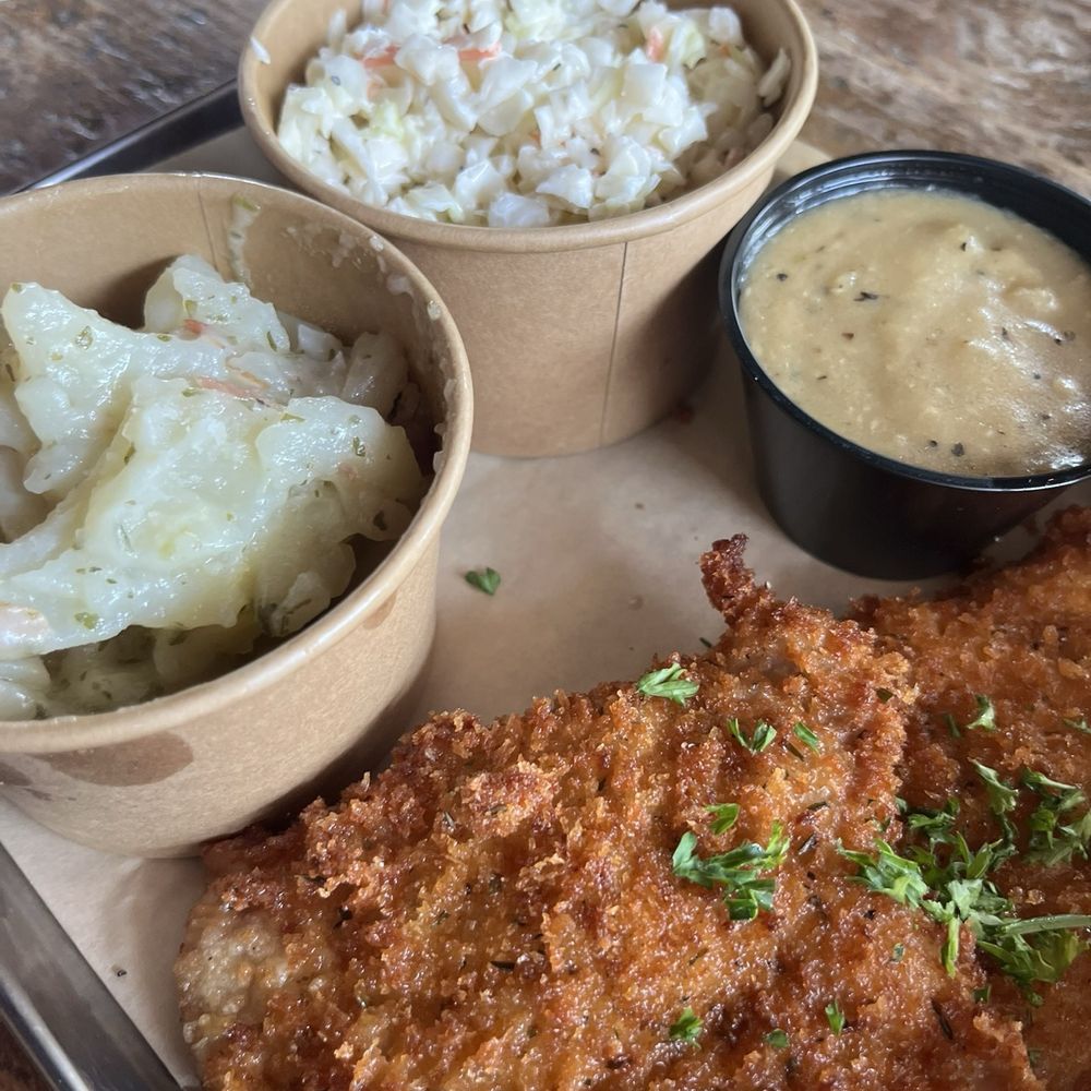 Fest Biergarten - Schnitzel platter with coleslaw and German potato salad - Beer Gardens Near Me - Midlothian, Virginia Fest Biergarten - Schnitzel platter with coleslaw and German potato salad - Beer Gardens Near Me - Midlothian, Virginia