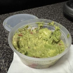 Tacos El Pachi - Guacamole arrived like this. Not full and a huge scoop dip in it. Yuck!