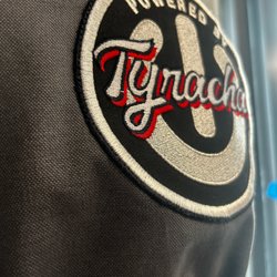 Pennington Designs - Close up of custom embroidered patch on apron