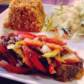 Drelyse African Restaurant - Goat stew with jollof rice - African Near Me - Columbus, Ohio Drelyse African Restaurant - Goat stew with jollof rice - African Near Me - Columbus, Ohio