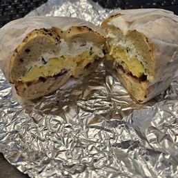Egg, bacon and cheese bagel with cream cheese.