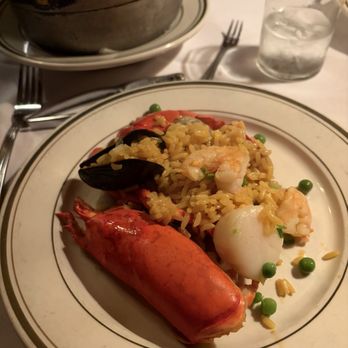Sevilla Restaurant & Bar - Paella plating - Spanish Near Me - New York, New York Sevilla Restaurant & Bar - Paella plating - Spanish Near Me - New York, New York