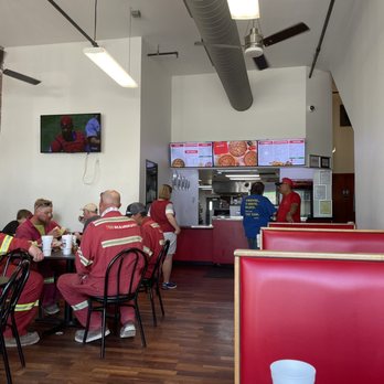Imo's Pizza - a group of people sitting at a table - Pizza Near Me - Saint Louis, Missouri Imo's Pizza - a group of people sitting at a table - Pizza Near Me - Saint Louis, Missouri