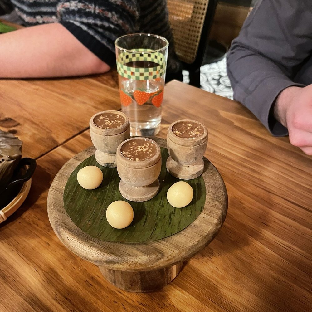 Naks - Dessert. Little melted chocolate glasses with peanut on top and little cream balls. - Filipino Near Me - New York, New York Naks - Dessert. Little melted chocolate glasses with peanut on top and little cream balls. - Filipino Near Me - New York, New York