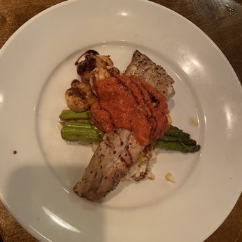 Table 9 - Special of the day. Redfish? On a bed of risotto and lightly grilled asparagus with a few perfectly cooked shrimp and a tomato cream sauce. - Seafood Near Me - Atlantic Beach, North Carolina Table 9 - Special of the day. Redfish? On a bed of risotto and lightly grilled asparagus with a few perfectly cooked shrimp and a tomato cream sauce. - Seafood Near Me - Atlantic Beach, North Carolina