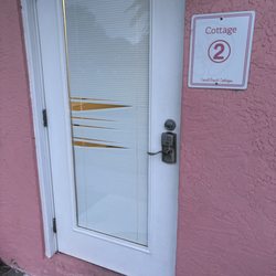 Coral Beach Cottages - Screens tore up within glass. No privacy.