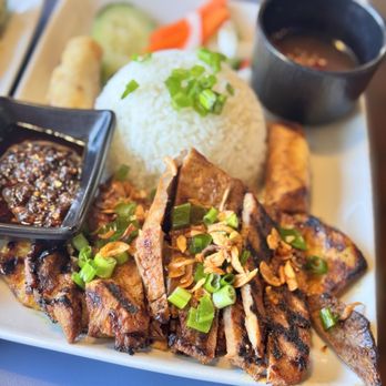 Com Nha Kitchen & Bar - Cơm Đặc Biệt A combination marinated beef, pork, and chicken served with rice and eggrolls. - Vietnamese Near Me - Denver, Colorado Com Nha Kitchen & Bar - Cơm Đặc Biệt A combination marinated beef, pork, and chicken served with rice and eggrolls. - Vietnamese Near Me - Denver, Colorado