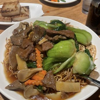 Hong Kong Bistro - Beef Pan Fried Noodle with gravy - Cantonese Near Me - Seattle, Washington Hong Kong Bistro - Beef Pan Fried Noodle with gravy - Cantonese Near Me - Seattle, Washington