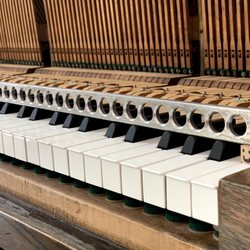 Piano Science - A key leveling stick helps our registered piano technicians determine which keys are no longer at specification.