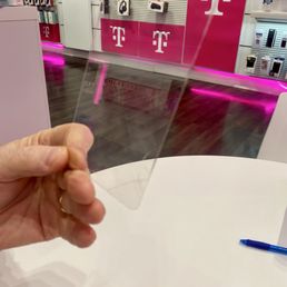 My husband holding the cracked screen protector