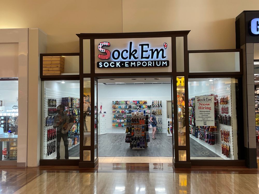 Sock Em’ Sock Emporium Logo