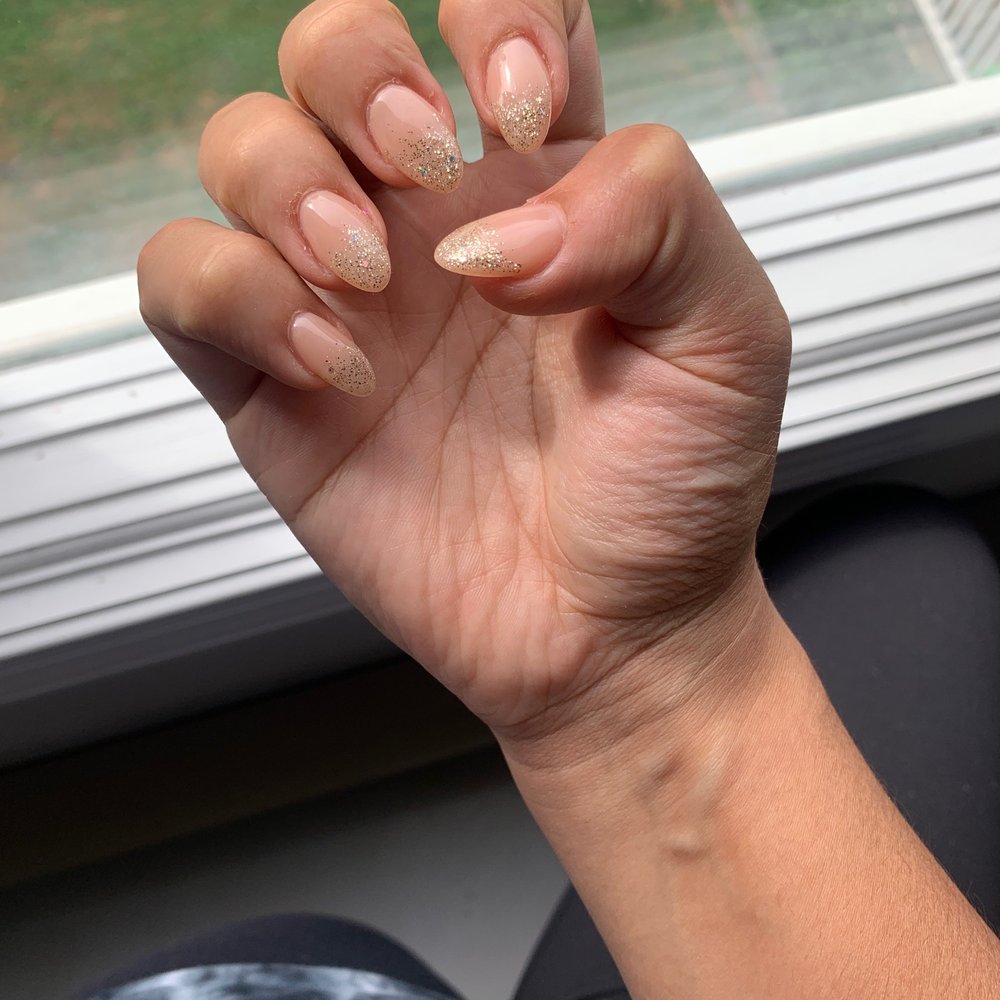 Ombré glitter nails with a nude color  Almond shape