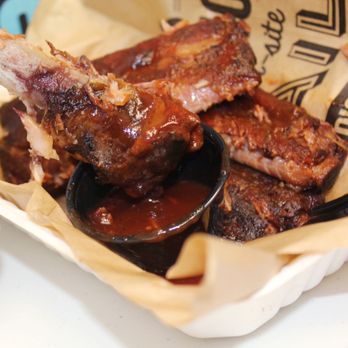 Dickey's Barbecue Pit - ribs and sauce in a basket - Barbeque Near Me - Mandan, North Dakota Dickey's Barbecue Pit - ribs and sauce in a basket - Barbeque Near Me - Mandan, North Dakota