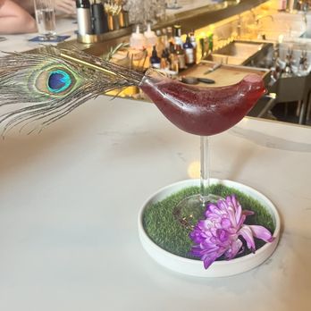 Bridges & Bourbon - The Peacock - gin, blueberry coconut syrup, lime juice, pimento bitters, served in the infamous bird glass - New American Near Me - Pittsburgh, Pennsylvania