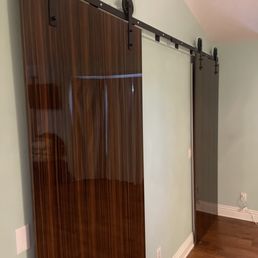 Barn-door pulleys and door stay fixture