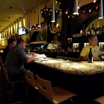 A Taste Above - people sitting at a bar - New American Near Me - Maple Heights, Ohio