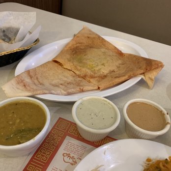 Mamaeatz - Mysore masala dosa, lentil soup, coconut chutney, and peanut chutney. With paratha in the background. - Indian Near Me - Farmington Hills, Michigan Mamaeatz - Mysore masala dosa, lentil soup, coconut chutney, and peanut chutney. With paratha in the background. - Indian Near Me - Farmington Hills, Michigan