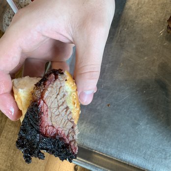 City Barbeque - My meal plus my son held up a nice beautiful piece of brisket - Barbeque Near Me - Beachwood, Ohio City Barbeque - My meal plus my son held up a nice beautiful piece of brisket - Barbeque Near Me - Beachwood, Ohio
