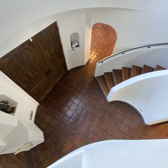 Alex Stone & Tile Services - a spiral staircase - Flooring Near Me