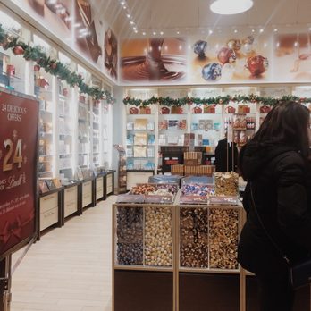 Lindt Chocolate Shop - a woman shopping in a store - Chocolatiers & Shops Near Me - Mississauga, Ontario Lindt Chocolate Shop - a woman shopping in a store - Chocolatiers & Shops Near Me - Mississauga, Ontario