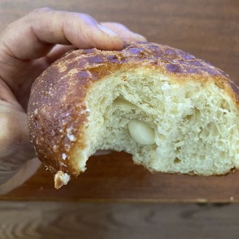A Leonard's Bakery - I think this was the custard. The way they "fill" the malasada has changed since the last time I bought. - Desserts Near Me - Waipahu, Hawaii