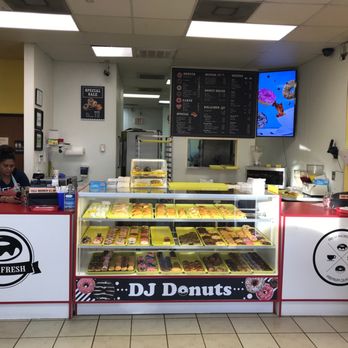D J Donut - a man behind the counter of a donut shop - Donuts Near Me - Aubrey, Texas D J Donut - a man behind the counter of a donut shop - Donuts Near Me - Aubrey, Texas