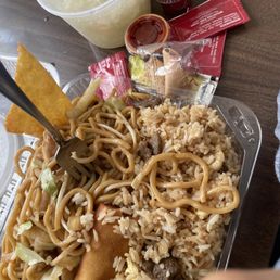 Half Chow Mein half Fried Rice combination with egg roll Half Chow Mein half Fried Rice combination with egg roll