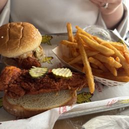 Hot Chicken slider and hot tender on white bread with fries. Hot Chicken slider and hot tender on white bread with fries.