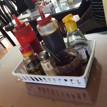 Kien Giang Pho - look at the chili sauce...no cover at all! just exposed to the air for God knows how long! it tasted like  crap too! - Vietnamese Near Me - Sechelt, British Columbia