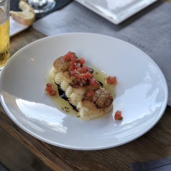 MIA Kitchen & Bar - Seared Scallops over whipped potatoes topped with diced tomatoes - New American Near Me - Delray Beach, Florida