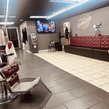 Exclusive Barber Shop - Inside view of waiting area, ATM, Large TV and Plenty of couch space - Barbers Near Me - Bloomsburg, Pennsylvania Exclusive Barber Shop - Inside view of waiting area, ATM, Large TV and Plenty of couch space - Barbers Near Me - Bloomsburg, Pennsylvania