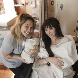 Micole Austin - Minutes after delivery with our doula Micole and new daughter.