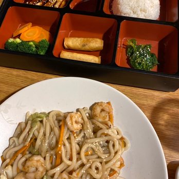 Chunmi Sushi - a plate of noodles and chopsticks - Japanese Near Me - Ballwin, Missouri