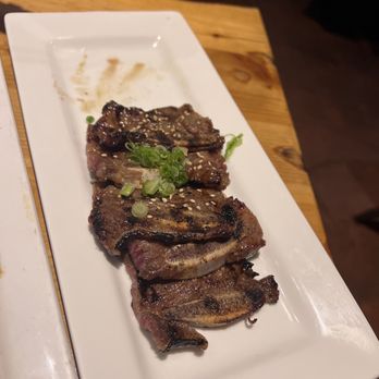 Umi Sake House - Short ribs on happy hour (one is missing, couldn't help it) - Sushi Bars Near Me - Seattle, Washington Umi Sake House - Short ribs on happy hour (one is missing, couldn't help it) - Sushi Bars Near Me - Seattle, Washington