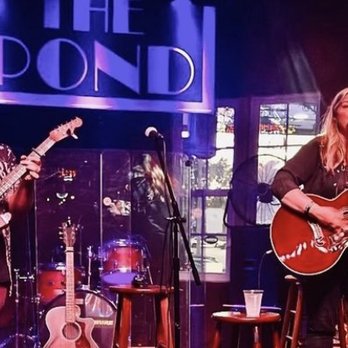 The Pond - a man and a woman playing guitars - Music Venues Near Me - Franklin, Tennessee The Pond - a man and a woman playing guitars - Music Venues Near Me - Franklin, Tennessee