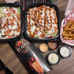 Classic mixed rice platter and spicy chicken rice platter and side Cajun fries