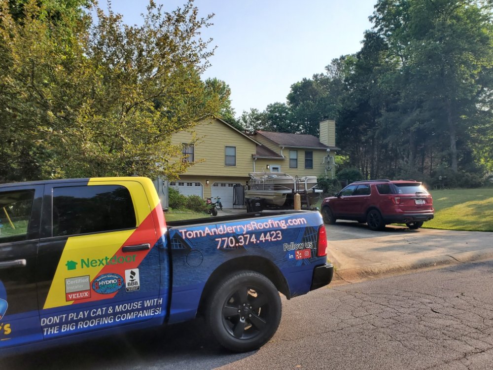 Slide of Tom and Jerry's Roofing