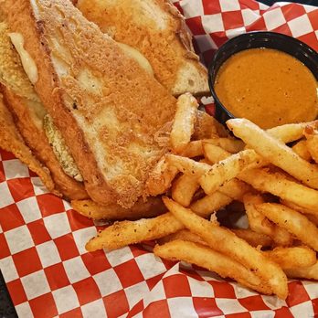 Riptides Pb - Grilled cheese w/fried pickles on it. French fries and dipping sauce. - Sports Bars Near Me - San Diego, California