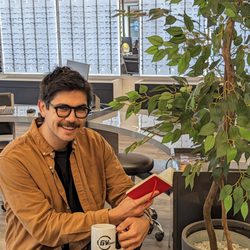 GV Optical - Styling his new eye glasses, Jonathon enjoys a cup of coffee and takes some notes before the day starts