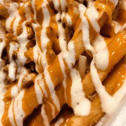 "Buffalo Blow Out" fry. Chicken, cheese, hot sauce and ranch