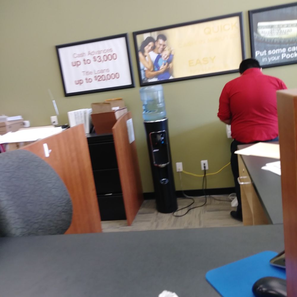 Cash Store - Man hard at work trying his best to help me out. - Check Cashing/Pay-day Loans Near Me - Porter, Texas