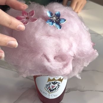 Nour's Cafe - Red Bull Mojito topped with cotton candy and edible flower decorations - Cafes Near Me - Sacramento, California Nour's Cafe - Red Bull Mojito topped with cotton candy and edible flower decorations - Cafes Near Me - Sacramento, California