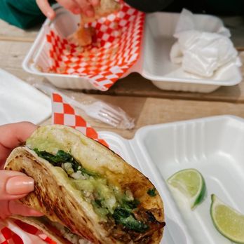 Ay Dios Mio Tacos - a person eating a sandwich - Food Trucks Near Me - Ottawa, Ontario Ay Dios Mio Tacos - a person eating a sandwich - Food Trucks Near Me - Ottawa, Ontario